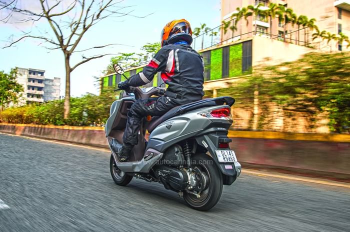 Suzuki Burgman rear left riding shot Suzuki Burgman rear left riding shot